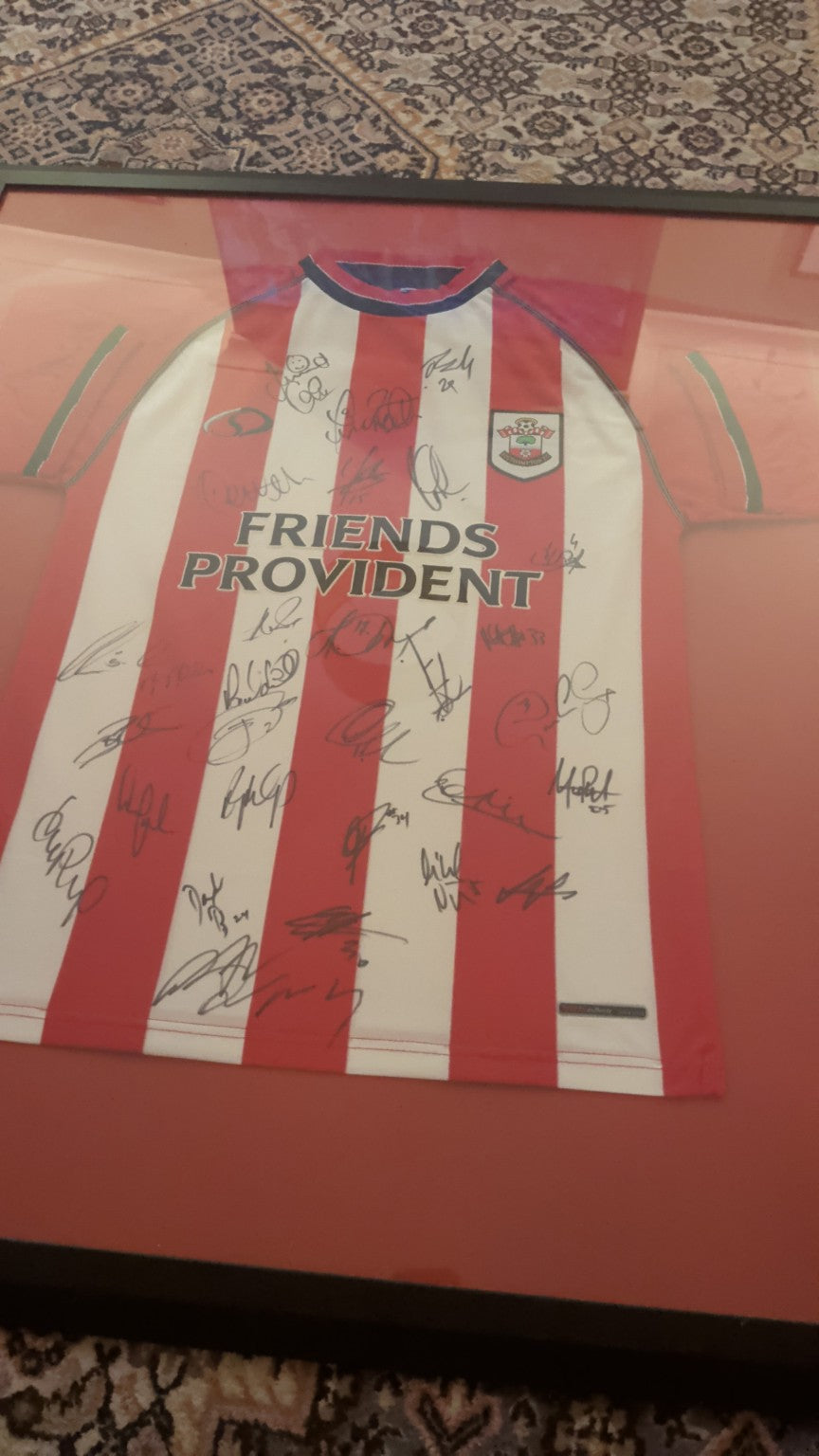 Closer view of the framed multi-signed Southampton shirt