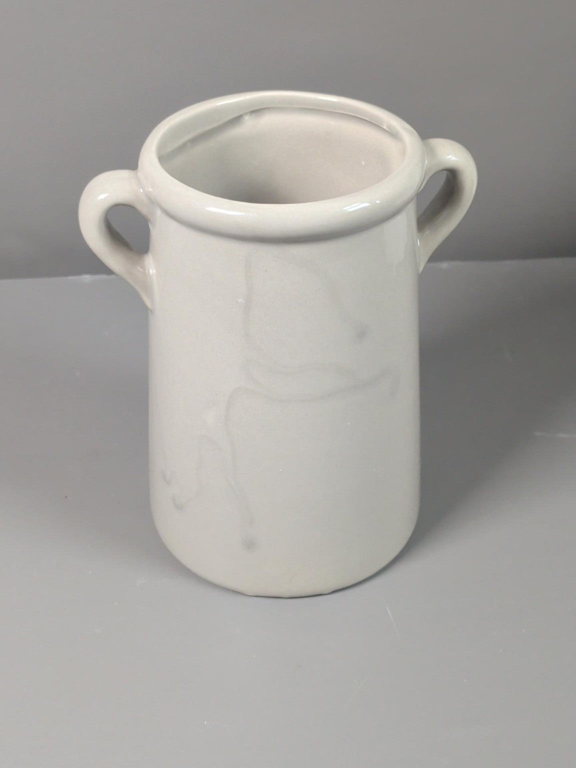 Cream ceramic two handled pot rear view