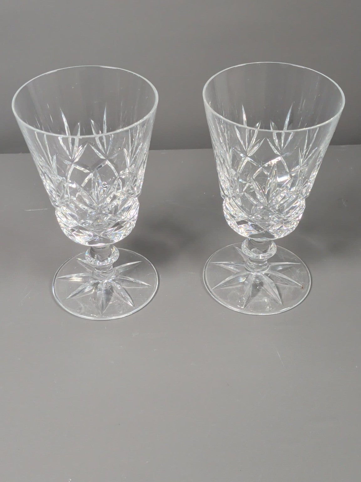 Pair of decorative cut glass stemmed goblets