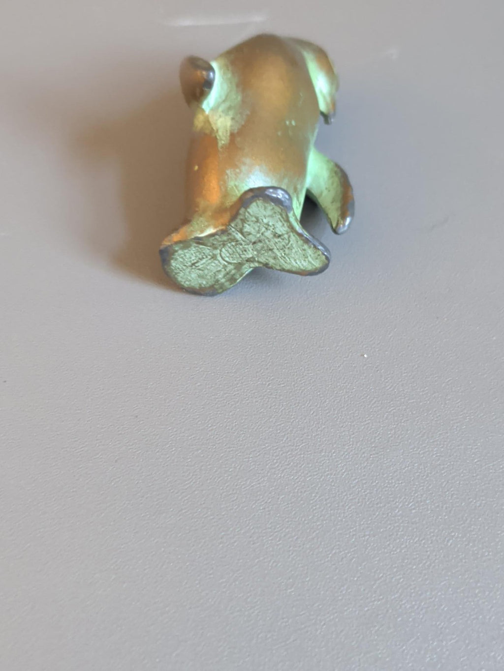Metal penguin underside