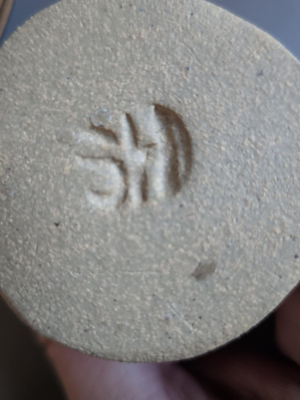 Impressed mark beneath pottery penguin