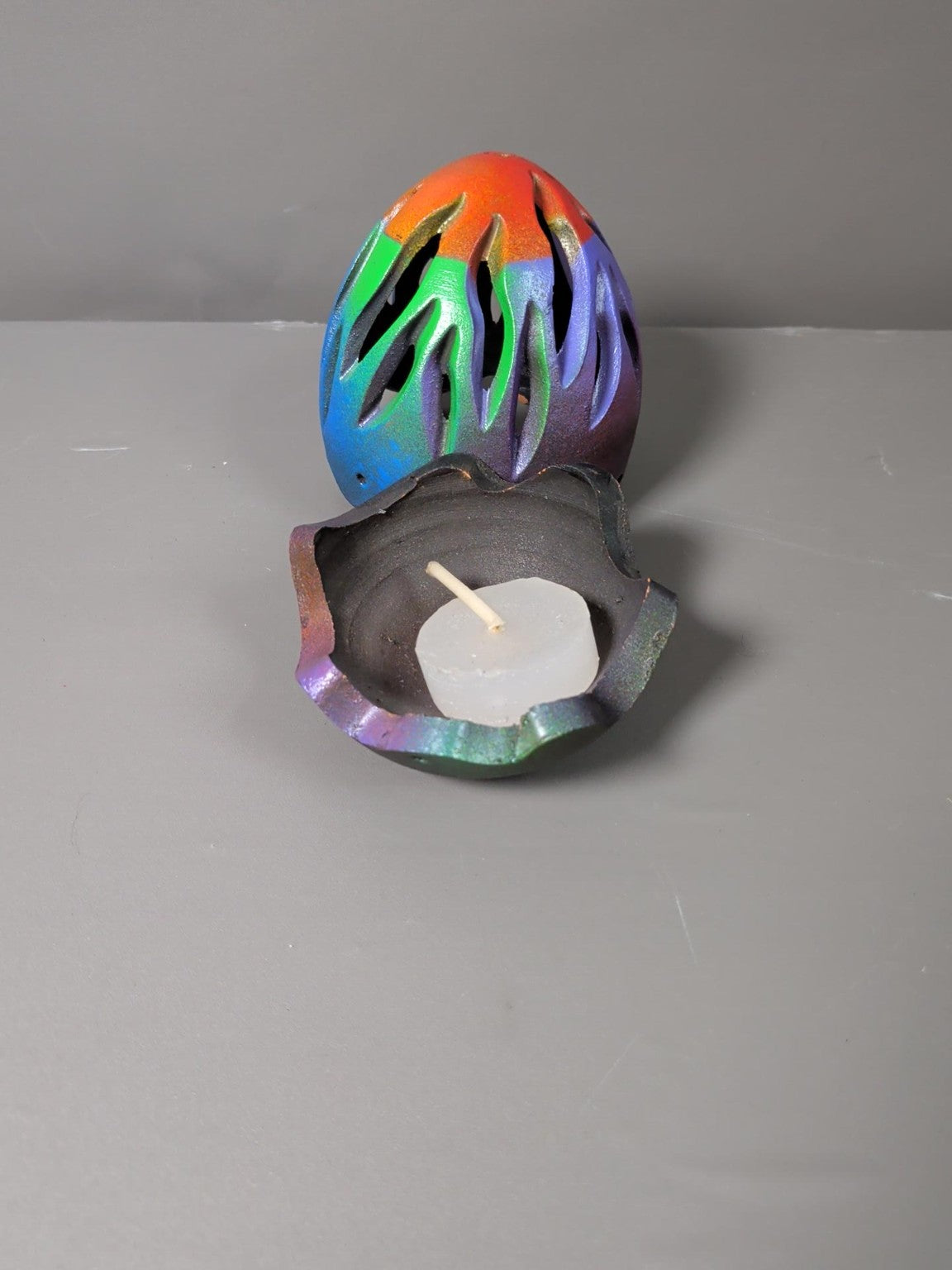 Egg tealight holder open with candle