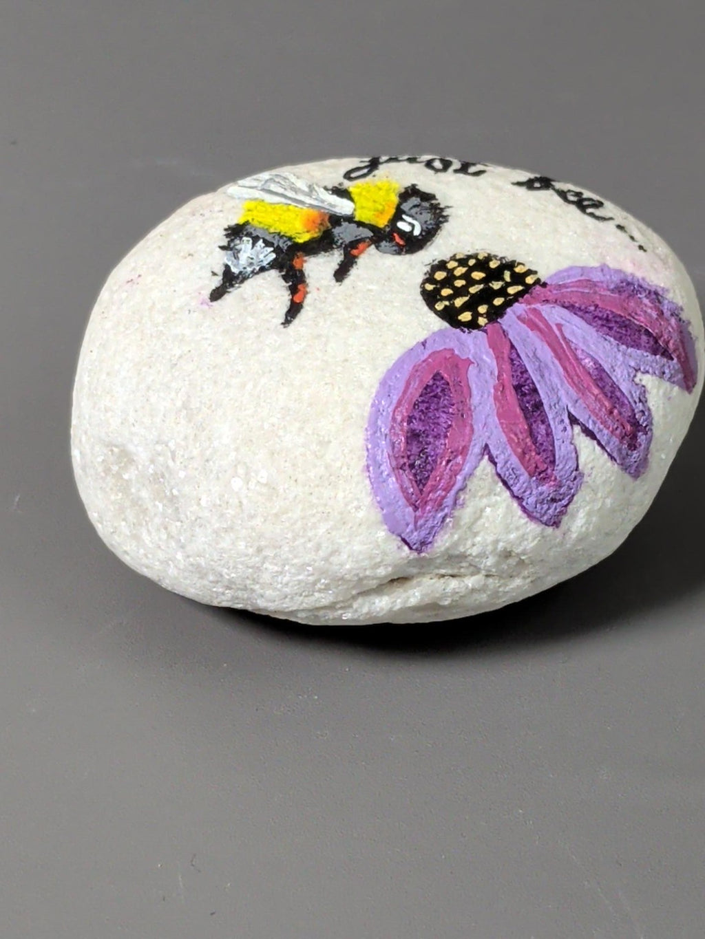 Bee and flower painted stone detail