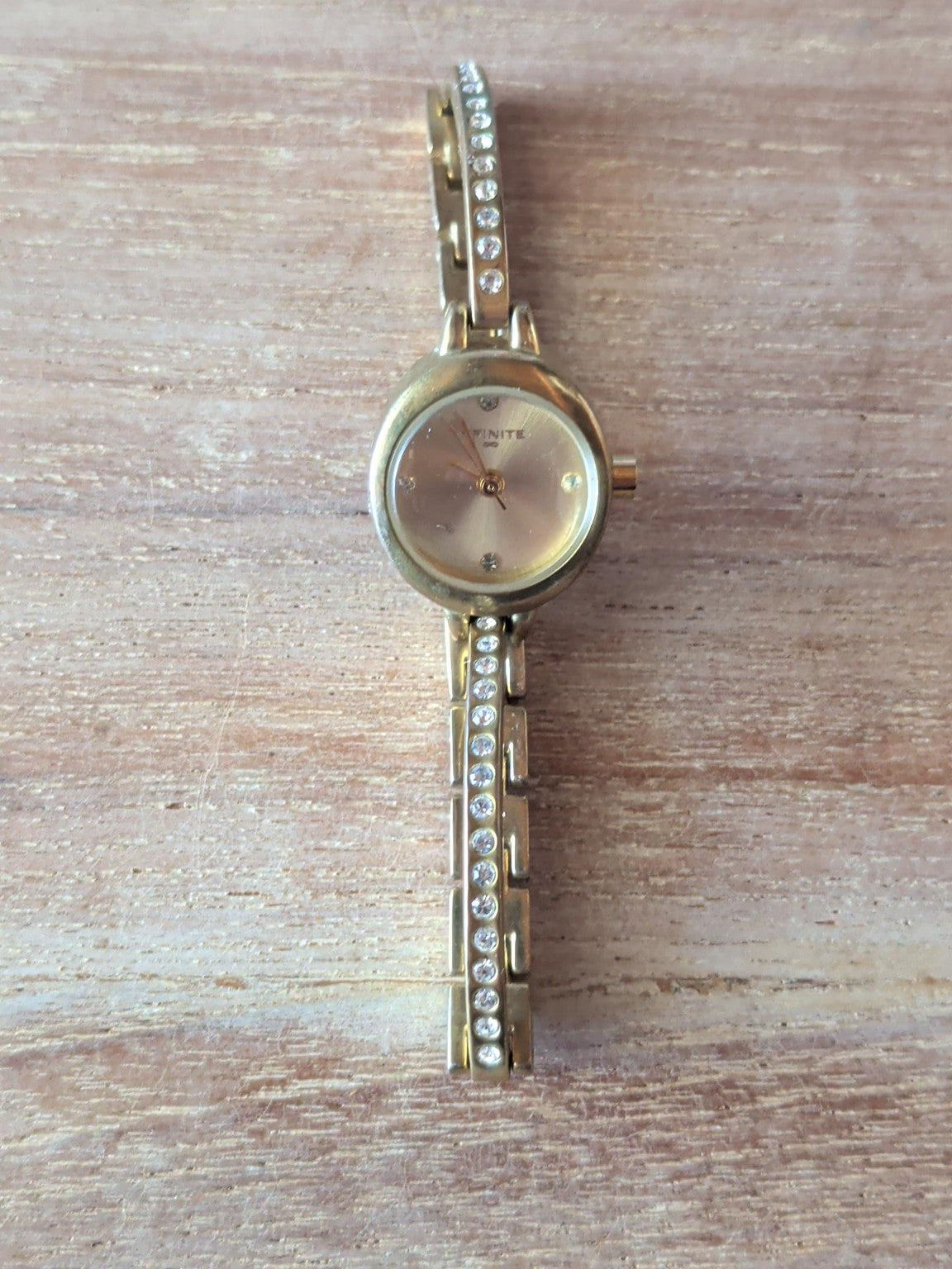Infinite ladies gold-tone crystal bracelet watch