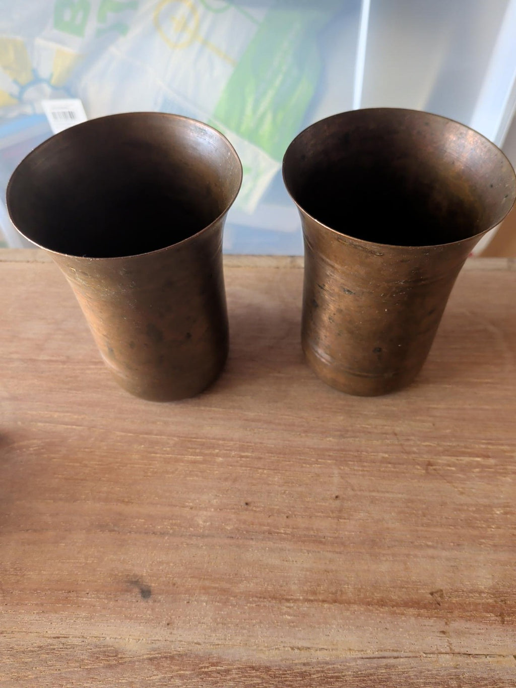 Pair of vintage copper brass beakers with aged patina