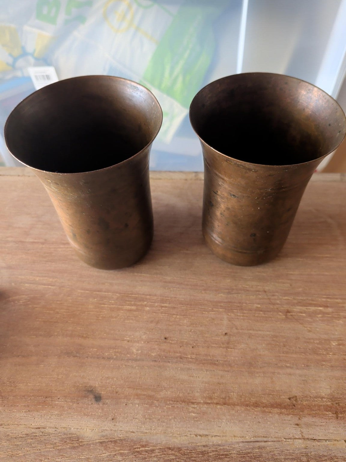 Pair of vintage copper brass beakers with aged patina