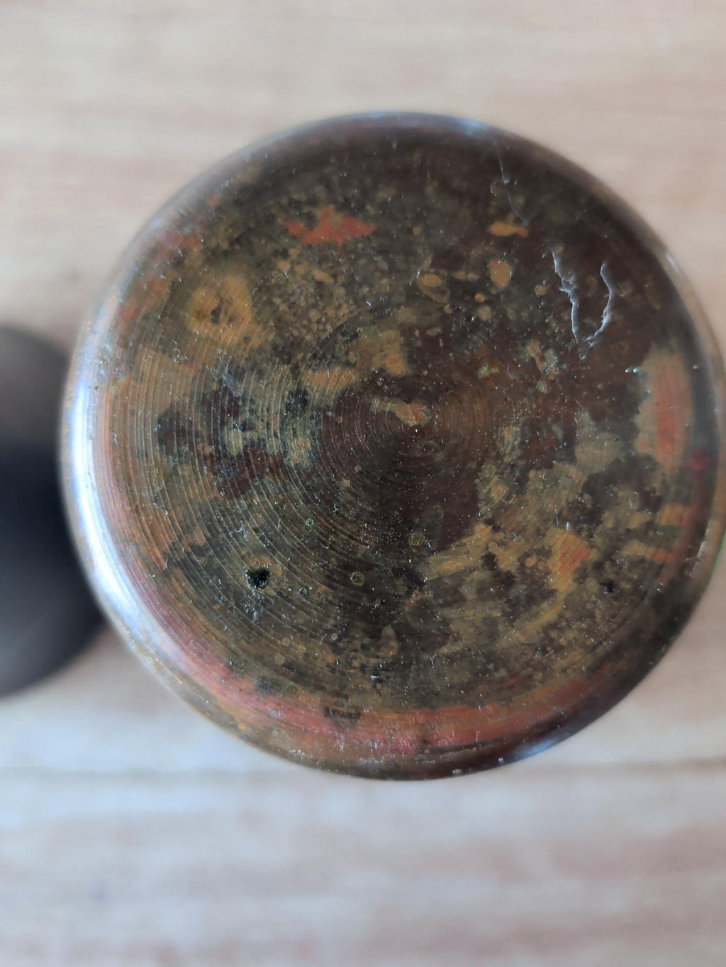 Base of second vintage copper brass beaker showing natural patina