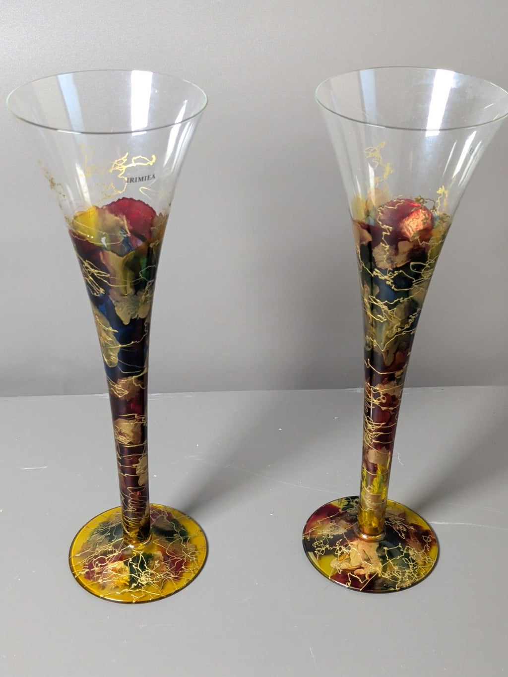Pair of Irimea hand decorated multicolour and gold art glass champagne flutes