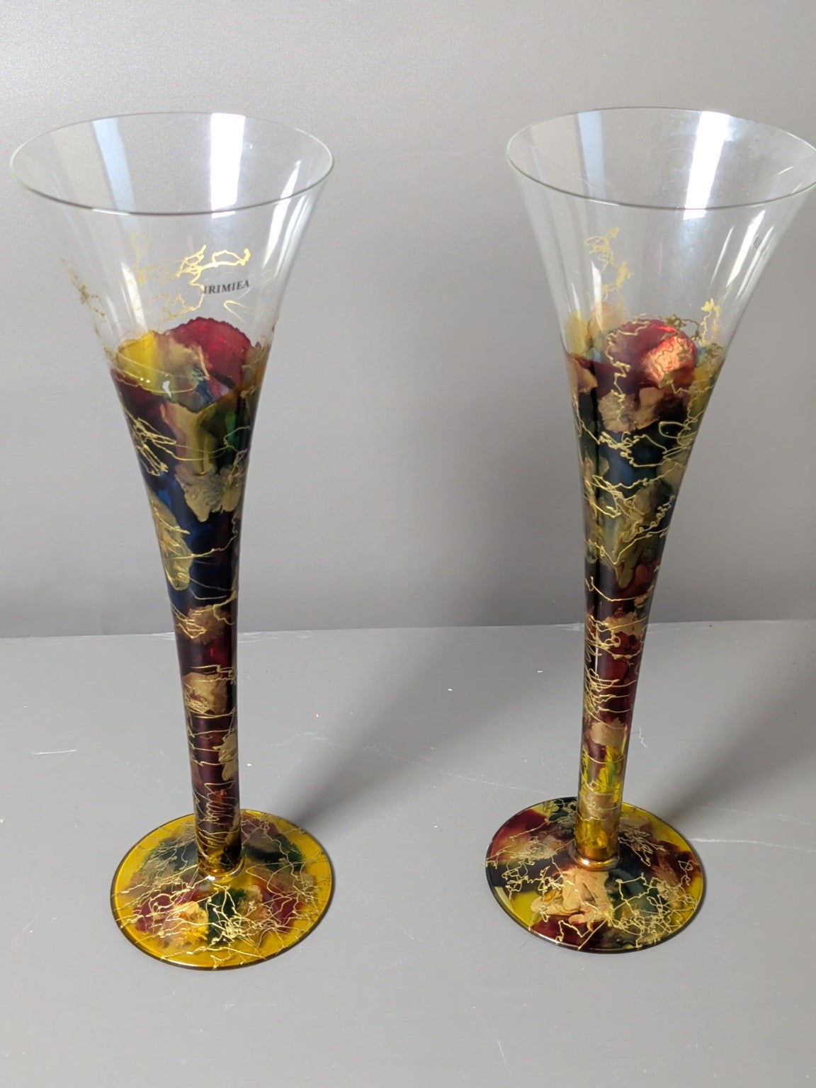 Pair of Irimea hand decorated multicolour and gold art glass champagne flutes