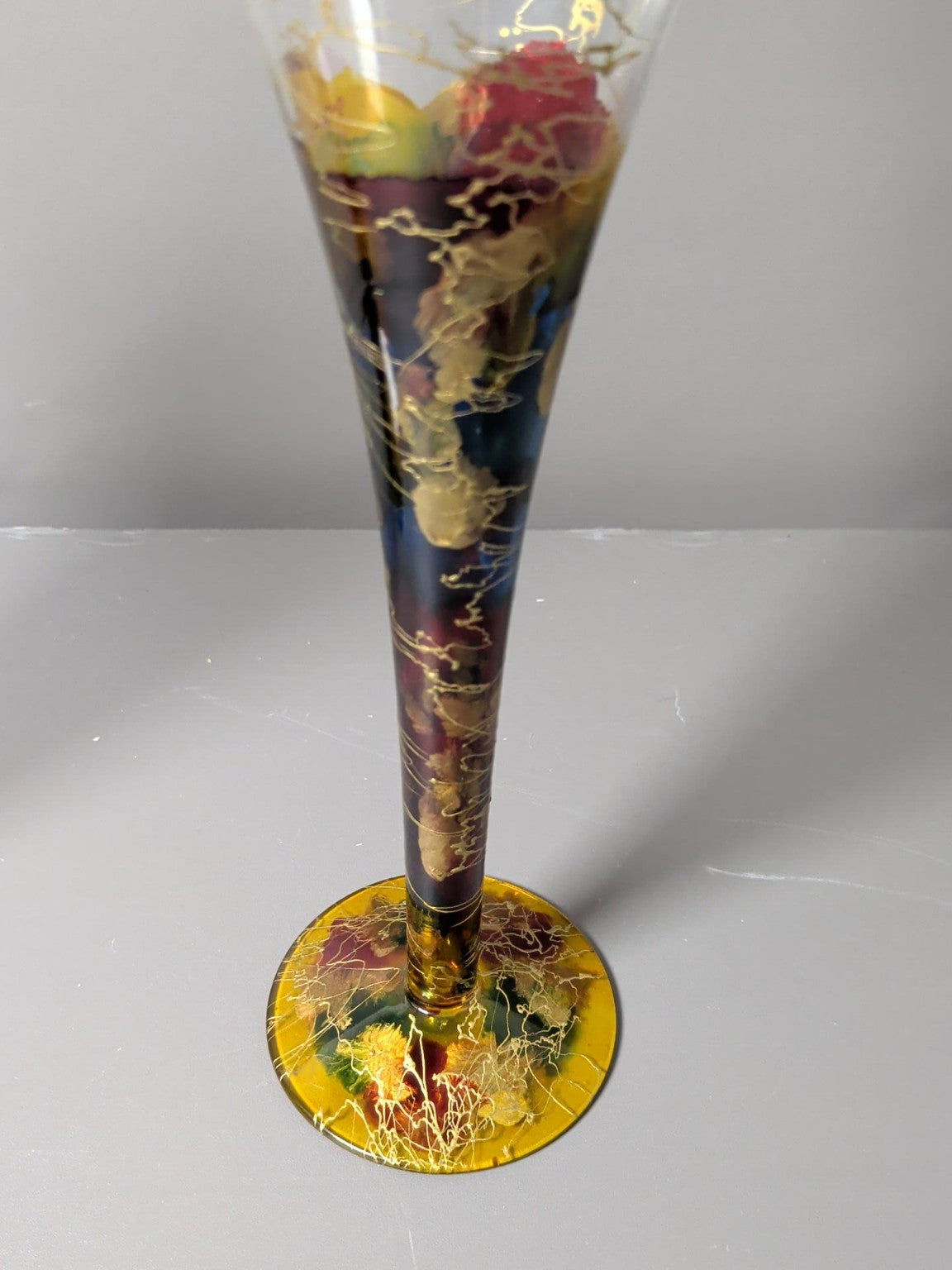 Gold detailed base and stem of Irimea art glass flute