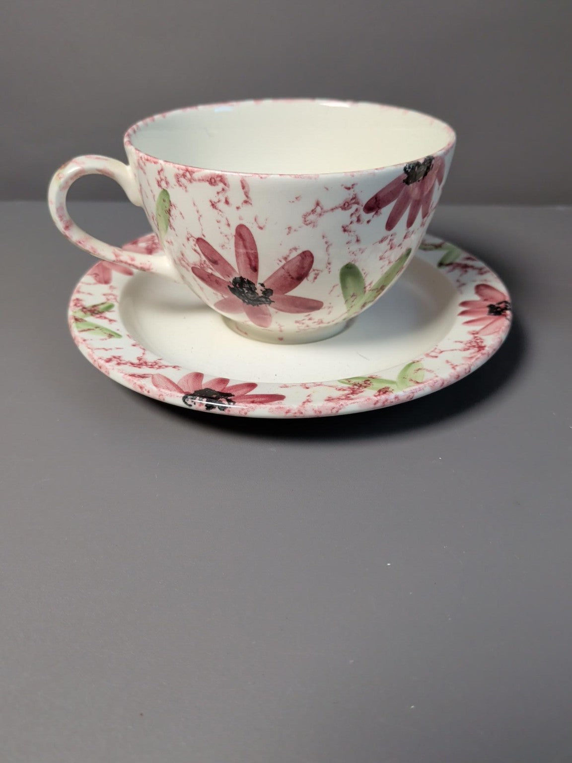 Poole Pottery floral cups and saucers side view