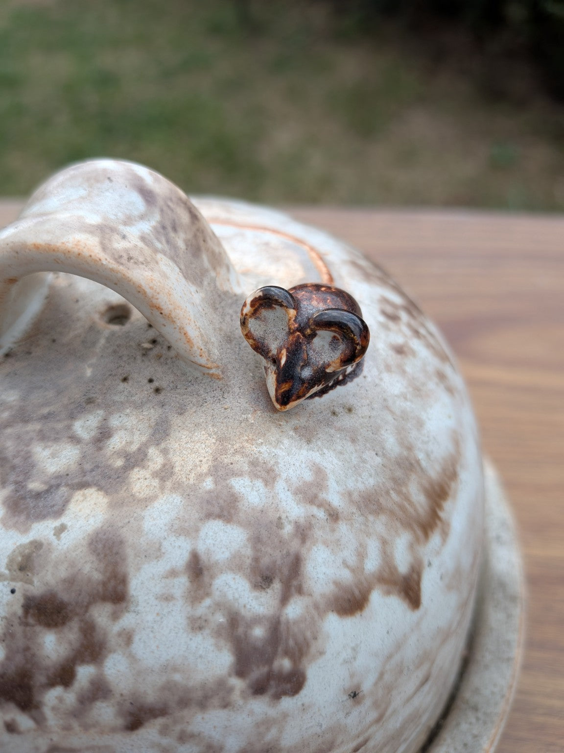Close-up of ceramic mouse detail and handle