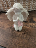 White kneeling praying angel ornament with pink glitter detail