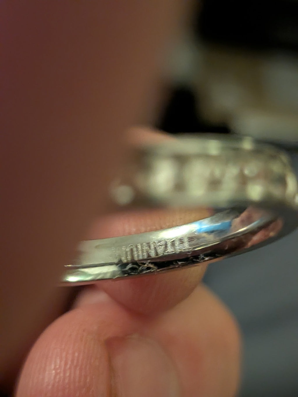 Titanium channel-set clear stone ring