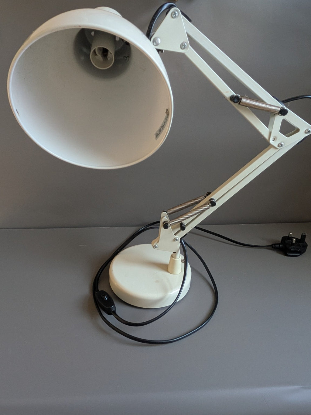 Thomas & Franks cream desk lamp showing shade, adjustable arm and base