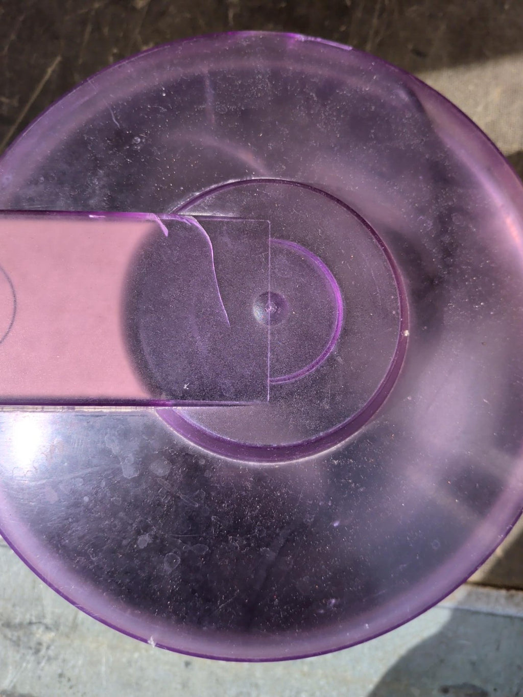 Actual purple lid with marks and scratches