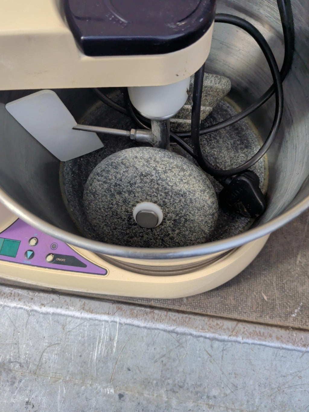 Actual stainless steel drum and granite stones