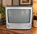 Vintage Bush CRT television with built-in VHS player in a modern vintage interior