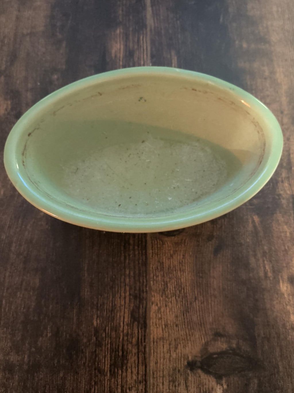 Interior of vintage pale green oval dish