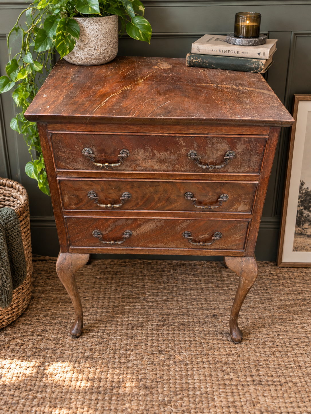 Vintage three drawer wooden chest with cabriole legs styled in a modern vintage interior
