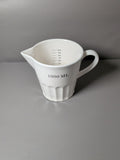 White ceramic 1 litre measuring jug with handle and pouring spout