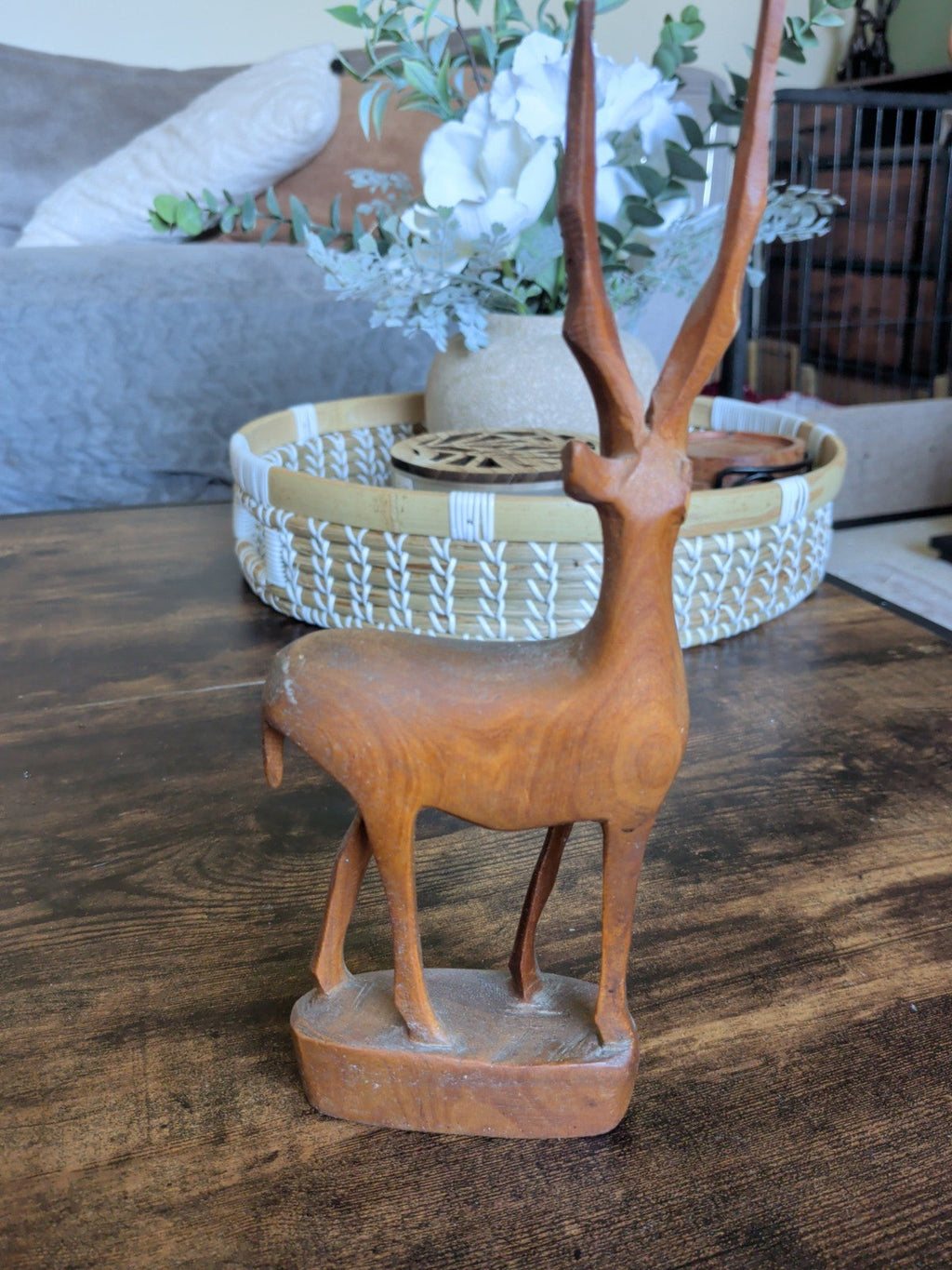Vintage hand carved wooden antelope figurine side view