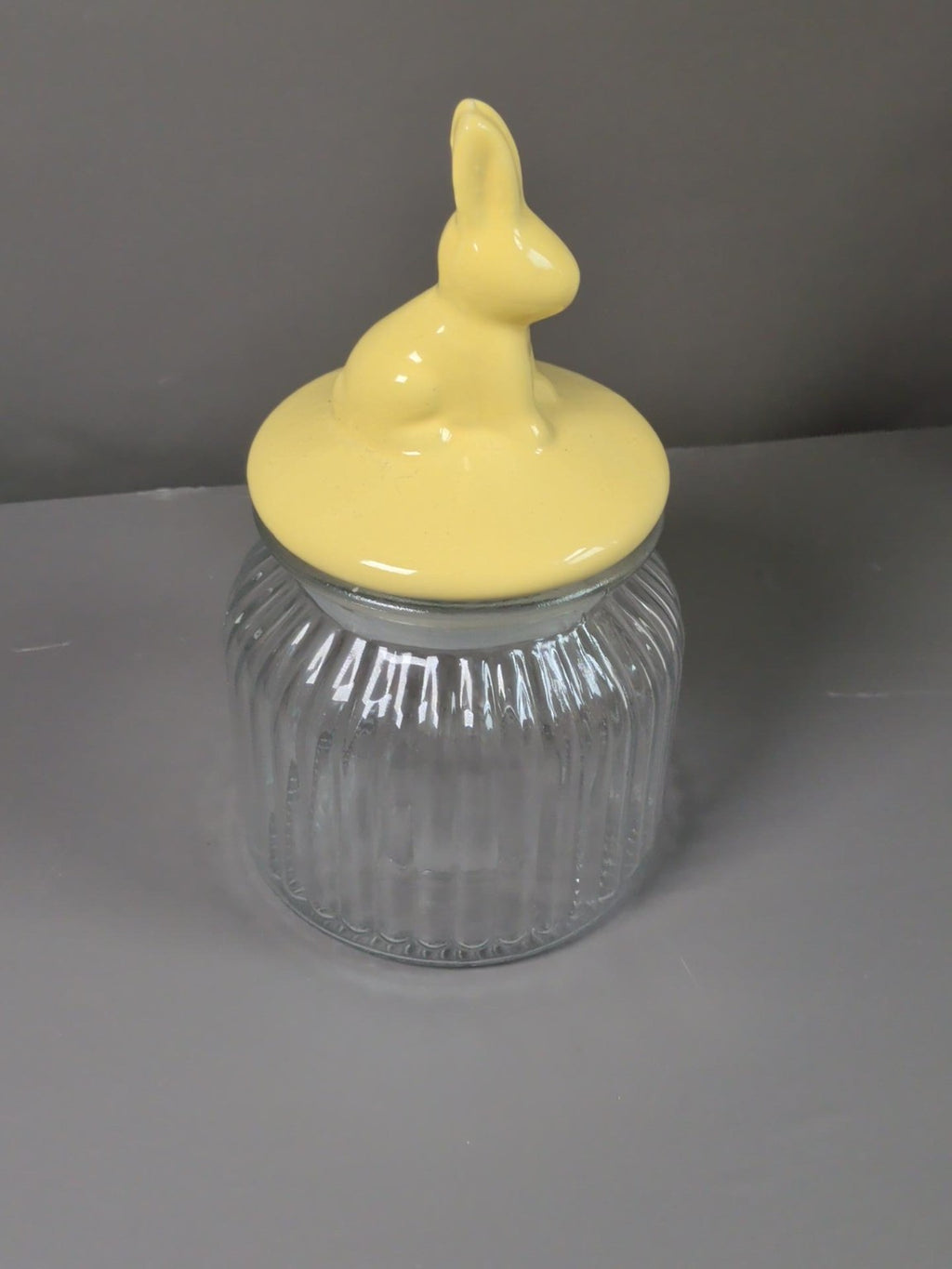 Yellow rabbit ceramic lid clear ribbed glass storage jar