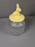 Yellow rabbit ceramic lid clear ribbed glass storage jar