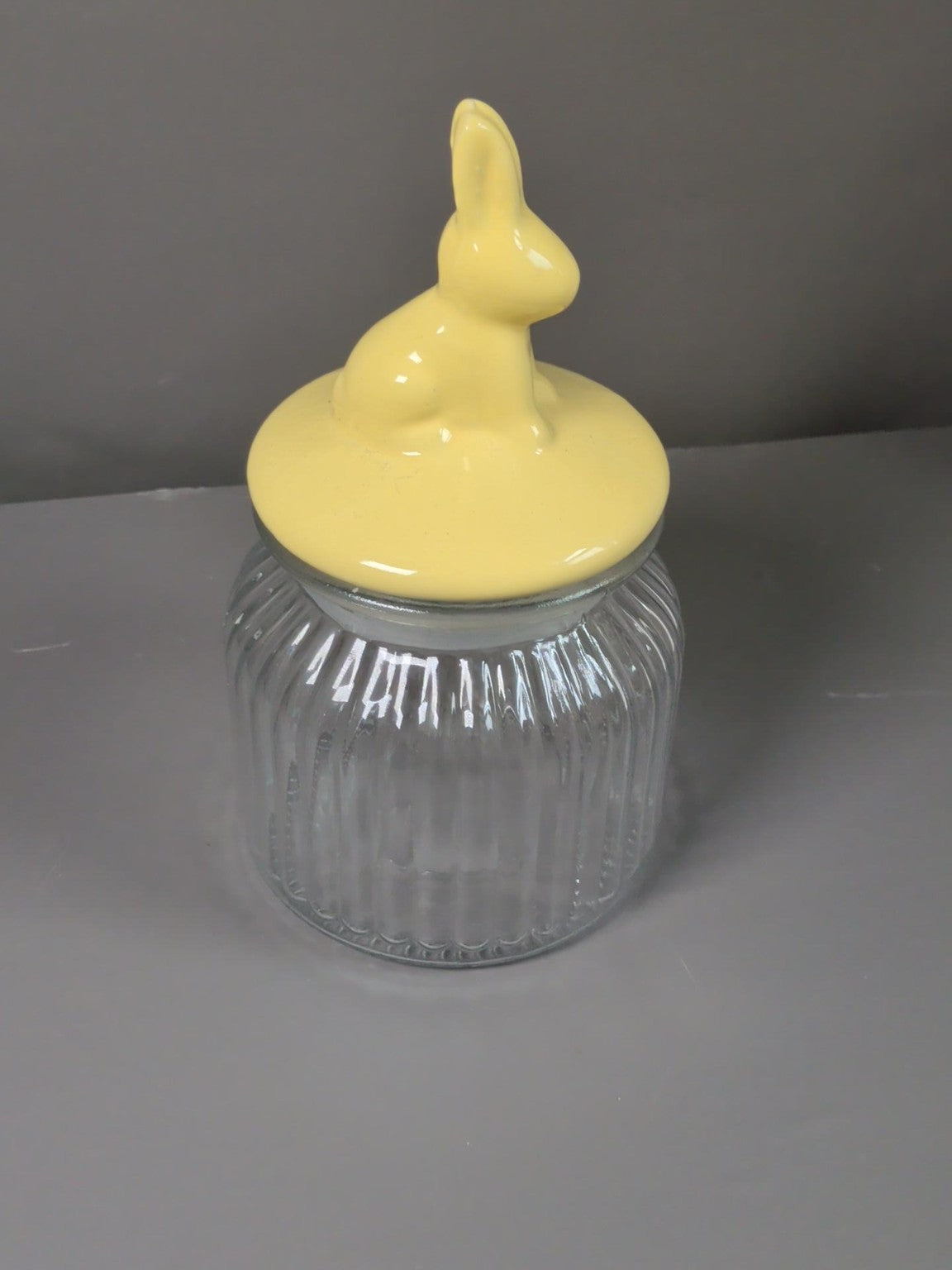 Yellow rabbit ceramic lid clear ribbed glass storage jar